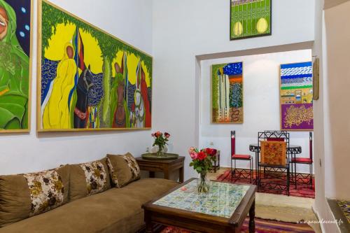 a living room with a couch and a table at Dar Halima in Essaouira