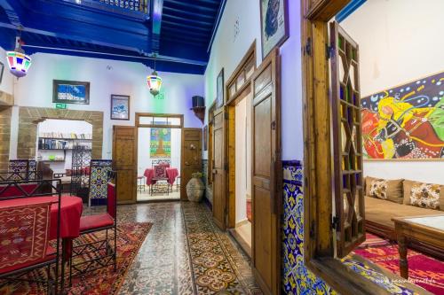 a hallway of a house with colorful tiles on the walls at Dar Halima in Essaouira