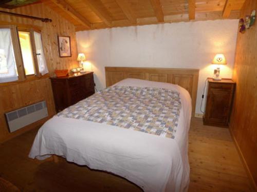 a bedroom with a large bed in a room at Chalet Samoëns, 4 pièces, 10 personnes - FR-1-629-5 in Samoëns
