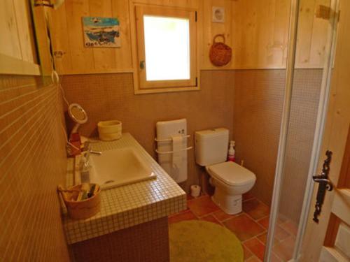a small bathroom with a toilet and a sink at Chalet Samoëns, 4 pièces, 10 personnes - FR-1-629-5 in Samoëns