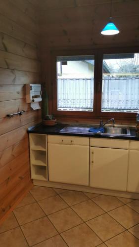 a kitchen with a sink and a counter top at Ferienwohnung Bermbach in Weilburg