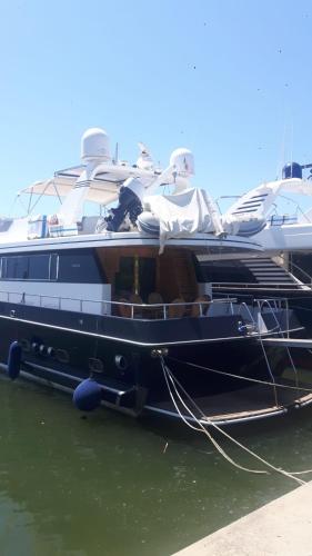 a large boat is docked in the water at Yatch Nelly Blue Rome in Lido di Ostia