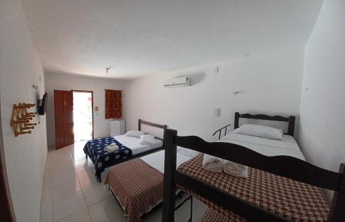 Postel nebo postele na pokoji v ubytování Manitu Flat Canoa Quebrada