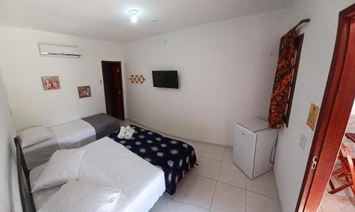 Postel nebo postele na pokoji v ubytování Manitu Flat Canoa Quebrada