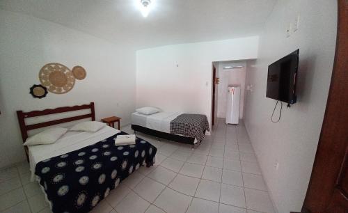 Postel nebo postele na pokoji v ubytování Manitu Flat Canoa Quebrada