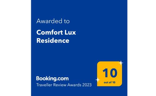 a yellow sign with the text awarded to comfort lux residence at Comfort Lux Residence in Banja Luka