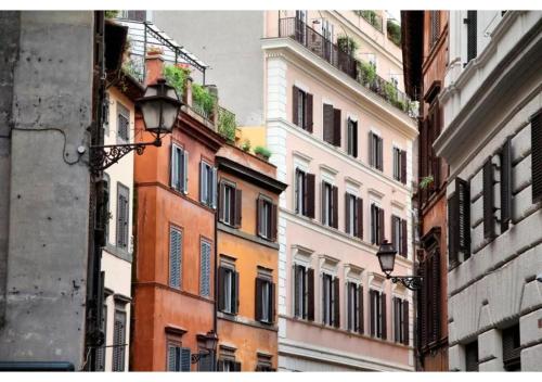 a group of buildings on a city street at Suites Giulia in Rome