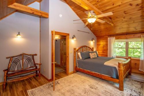 a bedroom with a bed and a wooden ceiling at The Hive at Blue Spruce Lodge White Mnts View in Brownfield