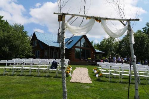 a set up for a wedding in front of a house at Big Sky Mountain Estate in Brownfield