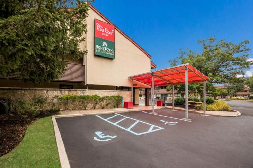 a parking lot in front of a store at Red Roof Inn Princeton - Ewing in Lawrenceville