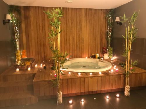 a bath tub with christmas lights in a bathroom at Blue Garden Hotel in Antalya