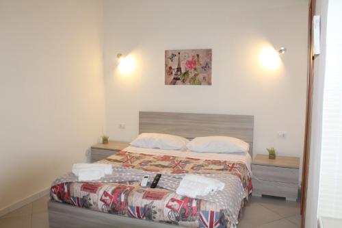 a bedroom with a large bed with at Casa Milù Napoli centro in Naples