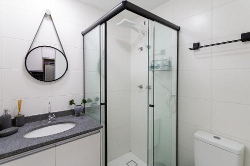 a bathroom with a shower and a sink at Studio com lazer e varanda no Alto da Boa Vista in Sao Paulo