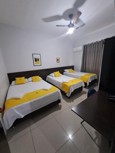 Postel nebo postele na pokoji v ubytování Hotel Panorama, Cuiabá