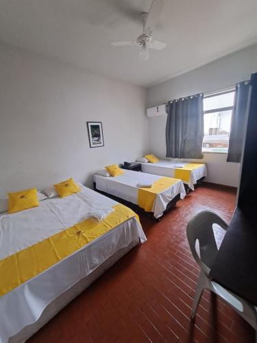Postel nebo postele na pokoji v ubytování Hotel Panorama, Cuiabá