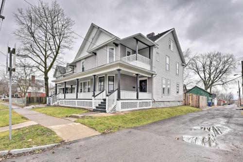 a large white house on the side of a street at Niagara Falls Townhome Near Wineries! in Niagara Falls