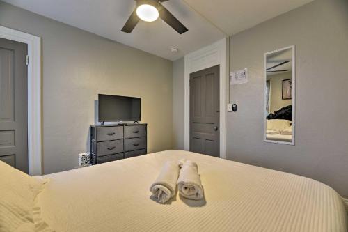 a bedroom with a bed with two towels on it at Niagara Falls Townhome Near Wineries! in Niagara Falls