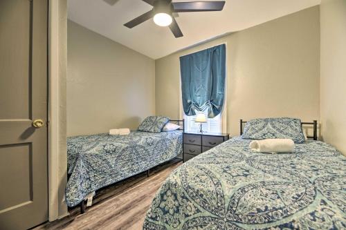 a bedroom with two beds and a window at Niagara Falls Townhome Near Wineries! in Niagara Falls