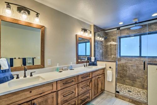 a bathroom with a large sink and a shower at Expansive Evergreen Home with Hot Tub and Deck! in Evergreen