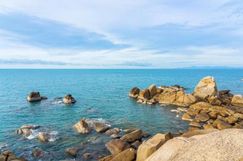 a large group of rocks in the water at Holiday Inn Resort Samui Bophut Beach by IHG in Bophut 