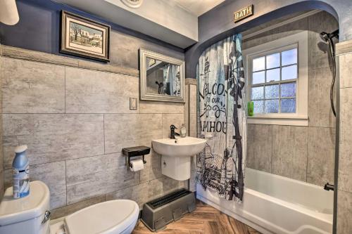 a bathroom with a sink and a toilet and a tub at Pet-Friendly Bartlett Farmhouse with Deck! in Bartlett