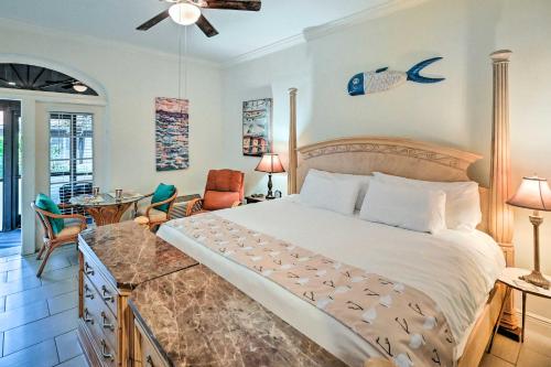 a bedroom with a large bed and a living room at Naples Studio Near Everglades with Marina! in Naples