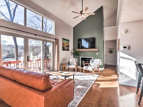 a living room with a couch and a table at Massanutten Resort Cabin Walk to Amenities in McGaheysville