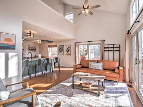 a living room with a couch and a table at Massanutten Resort Cabin Walk to Amenities in McGaheysville