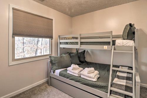 a bedroom with bunk beds and a window at Massanutten Resort Cabin Walk to Amenities in McGaheysville