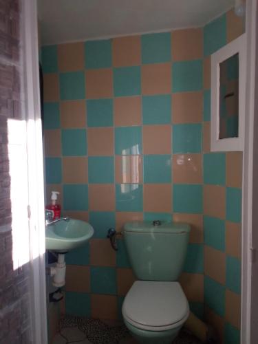 a bathroom with a toilet and a sink at Ocean Surf Lodge in Taghazout