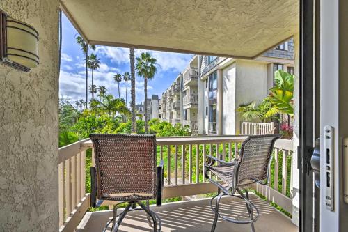 two chairs sitting on a porch with a balcony at Deja Blue Oceanside Condo on Beach with Pools! in Oceanside