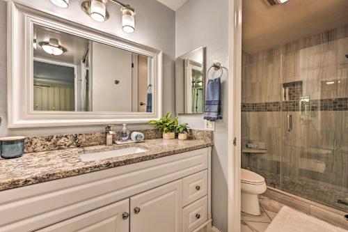 a bathroom with a sink and a toilet and a shower at Deja Blue Beachfront Condo with Resort Pools! in Oceanside