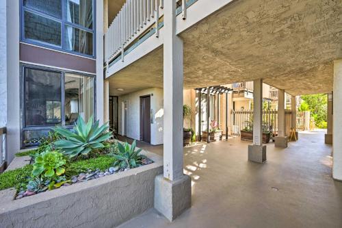 an empty courtyard of a building with plants at Deja Blue Oceanside Condo on Beach with Pools! in Oceanside