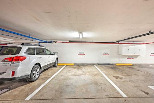 a white car parked in a parking lot at Deja Blue Oceanside Condo on Beach with Pools! in Oceanside
