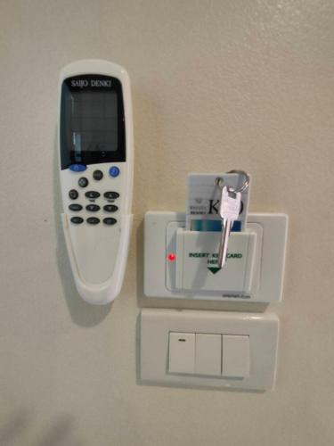 a cell phone is attached to a wall at Banana Resort Sadao in Sadao