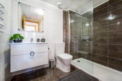 a bathroom with a toilet and a shower at Azul Beach by La Mata Beach in Torrevieja