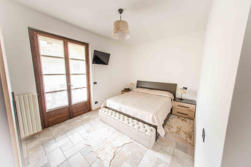 Ένα ή περισσότερα κρεβάτια σε δωμάτιο στο Agriturismo Rihane