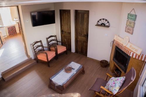 an overhead view of a living room with a fireplace at CASA RURAL VEGASAN in Santa Colomba de la Vega
