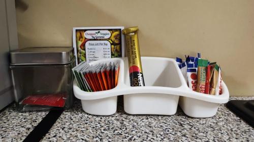a toothbrush holder sitting on top of a counter at Lighthouse Inn in Bloemfontein