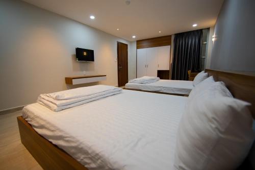 Katil atau katil-katil dalam bilik di Hạnh Trang Hotel