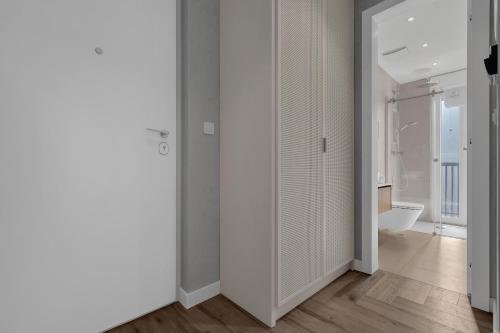 a room with white walls and a bathroom with a toilet at Villa Anchor in Baška Voda