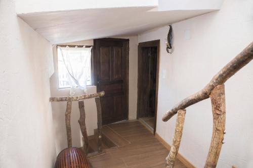 a room with a hallway with a door and a window at CASA RURAL VEGASAN in Santa Colomba de la Vega