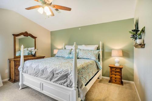 a bedroom with a bed and a ceiling fan at Holiday Hills Resort Condo Mins to Branson Strip! in Branson