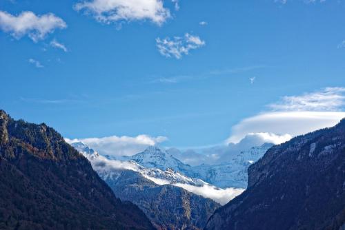 a view of a mountain range with snow capped mountains at Baeren Hotel, The Bear Inn in Wilderswil