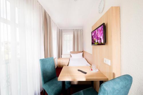 Μια τηλεόραση ή/και κέντρο ψυχαγωγίας στο Garni Eden Hotels