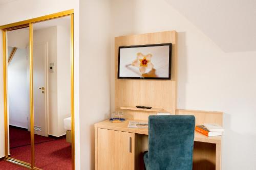 Μια τηλεόραση ή/και κέντρο ψυχαγωγίας στο Garni Eden Hotels