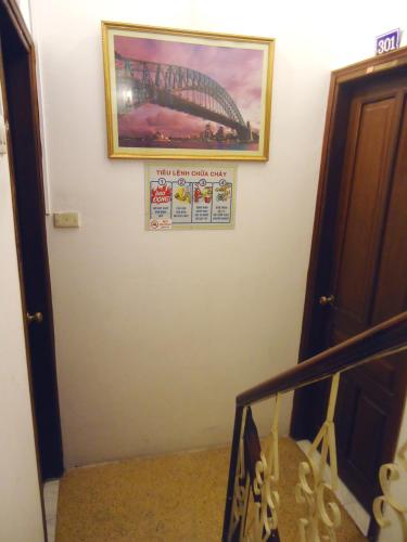 a staircase with a picture of the sydney opera house at North Hostel N.2 in Hanoi