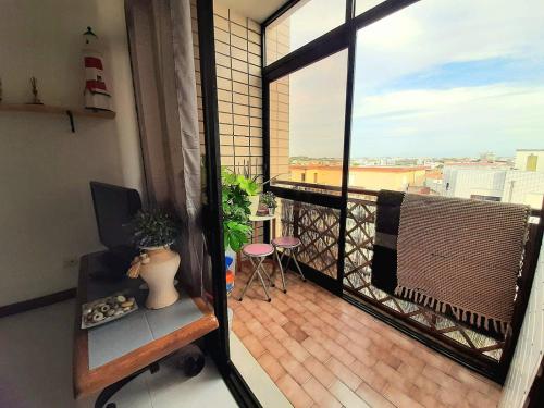 an apartment balcony with a view of a city at Appartement Quartier Calme sur la côte sauvage! 400m plage in Póvoa de Varzim