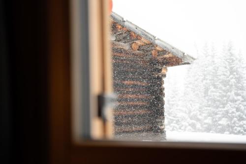 a view of a window with snow on it at Chalet Silvesterhütte in Seiser Alm 