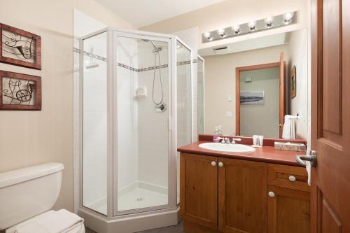 a bathroom with a shower and a sink at Deer Run by Whistler Premier in Whistler